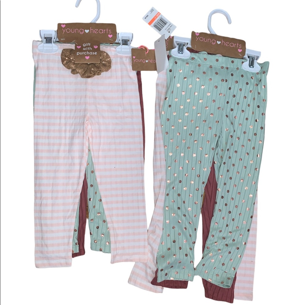 3 pair of leggings with a hair tie